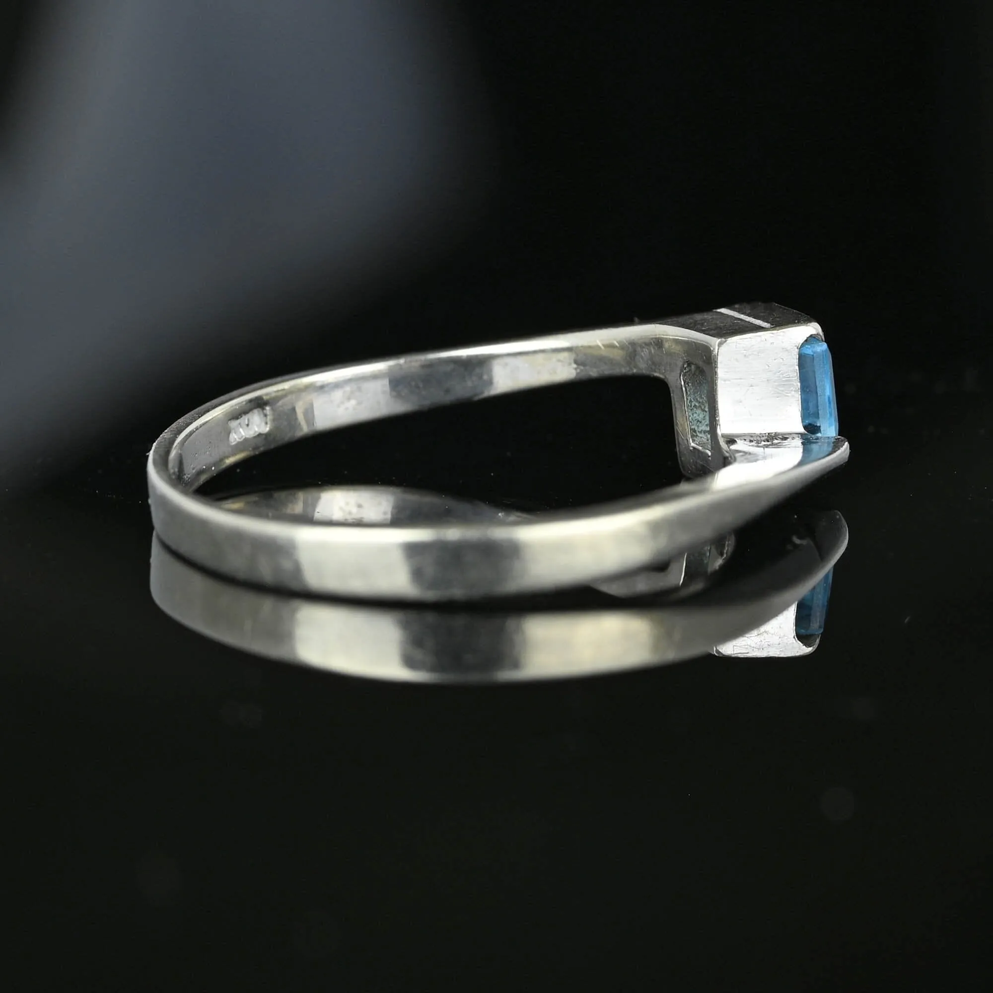 Bypass 10K White Gold Emerald Cut Blue Topaz Ring