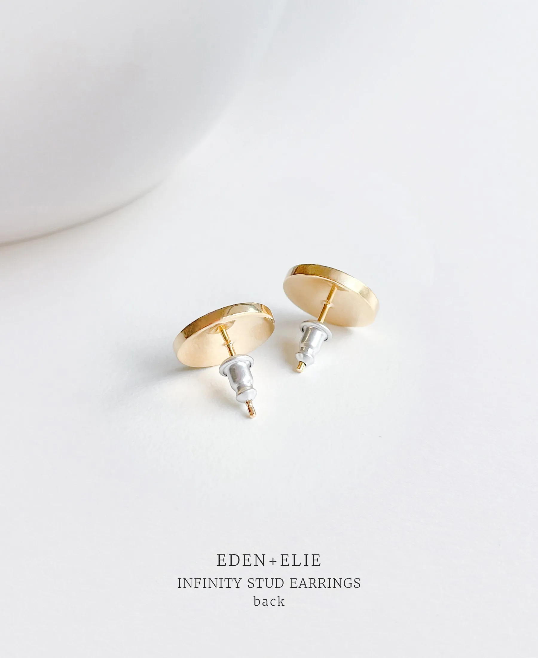 EDEN   ELIE Infinity stud earrings - shell