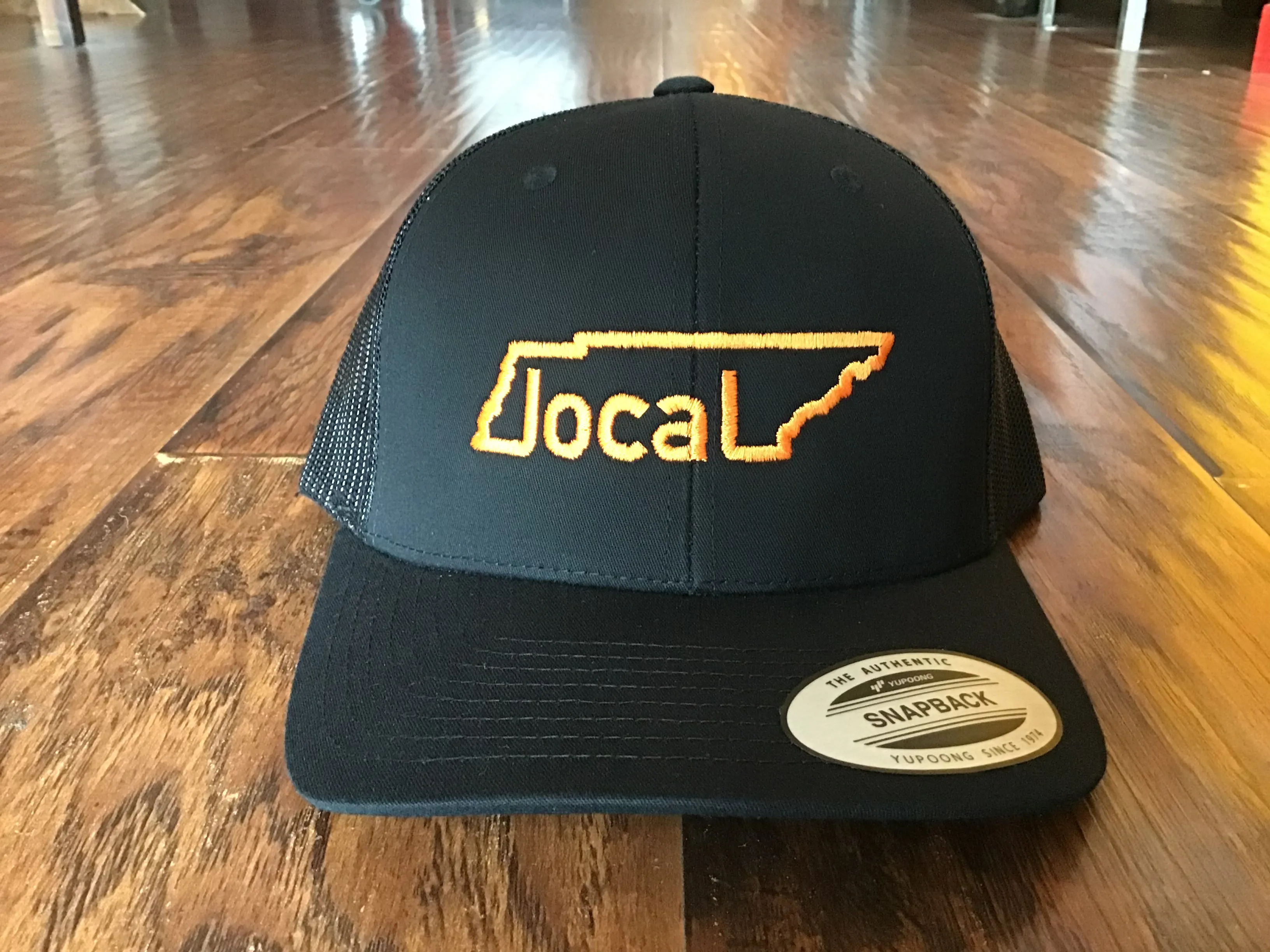 Local Trucker Hat - Black with Orange Stitching