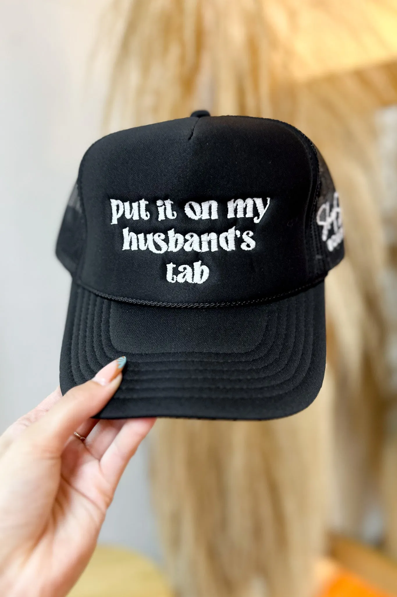 Put it on my Husbands Tab Trucker Hat